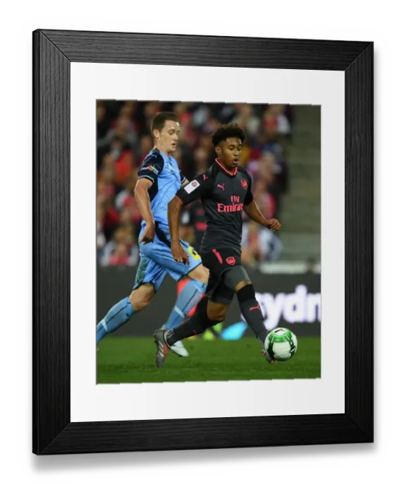 Framed Print : Reiss Nelson vs. Brandon O'Neill: A Riveting Battle in the Sydney FC vs. Arsenal Pre-Season Clash