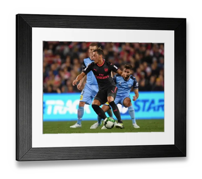 Framed Print : Mesut Ozil vs Michael Zullo: A Pre-Season Battle at ANZ Stadium