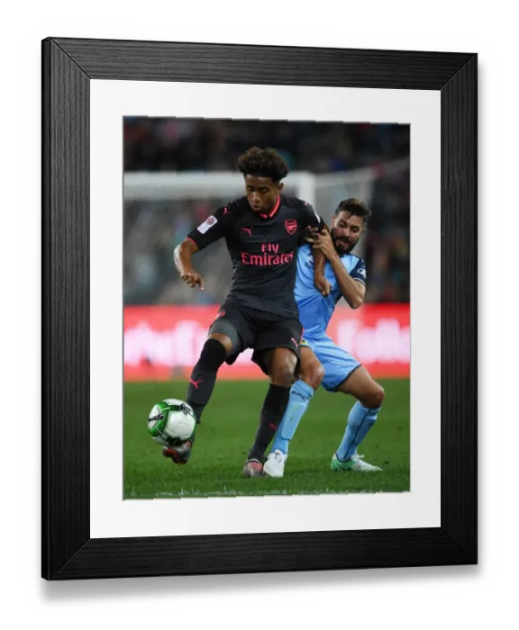 Framed Print : Reiss Nelson vs Michael Zullo: A Battle in the Pre-Season Friendly Between Sydney FC and Arsenal