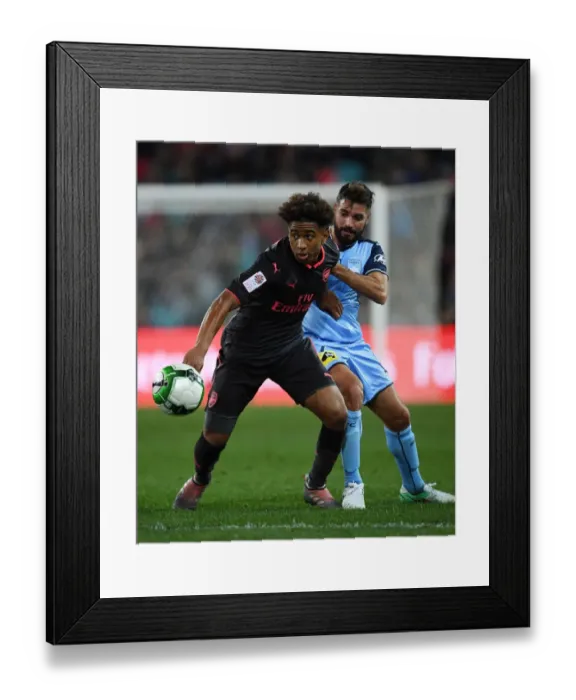 Framed Print : Reiss Nelson vs Michael Zullo: Battle at ANZ Stadium - Sydney FC vs Arsenal Pre-Season Clash
