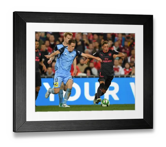Framed Print : Mesut Ozil Outsmarts Brandon O'Neill: Arsenal's Masterclass vs. Sydney FC