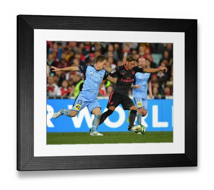 Framed Print : Mesut Ozil's Masterful Moves: Outsmarting Brandon O'Neill in Arsenal's Pre-Season Victory Framed Print : Mesut Ozil's Masterful Moves: Outsmarting Brandon O'Neill in Arsenal's Pre-Season Victory