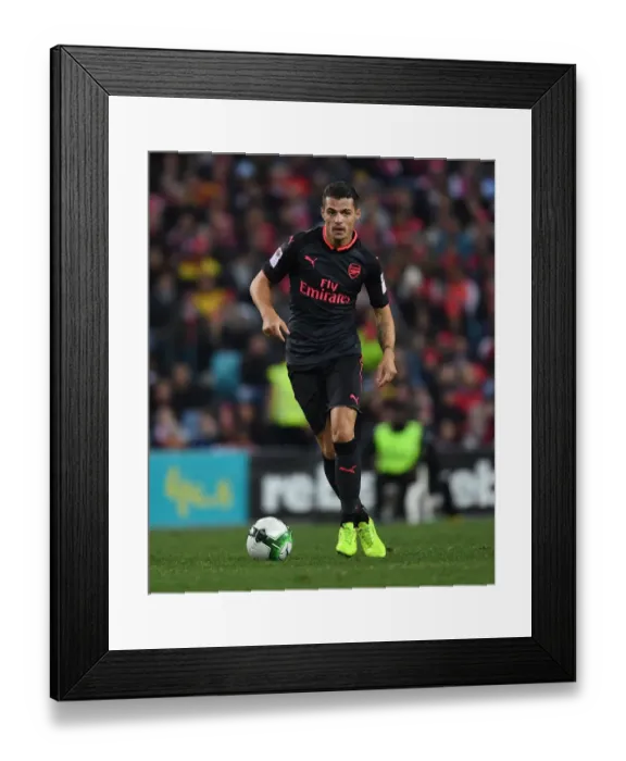 Framed Print : Granit Xhaka in Action: Arsenal's Pre-Season Clash with Sydney FC (2017) Framed Print : Granit Xhaka in Action: Arsenal's Pre-Season Clash with Sydney FC (2017)