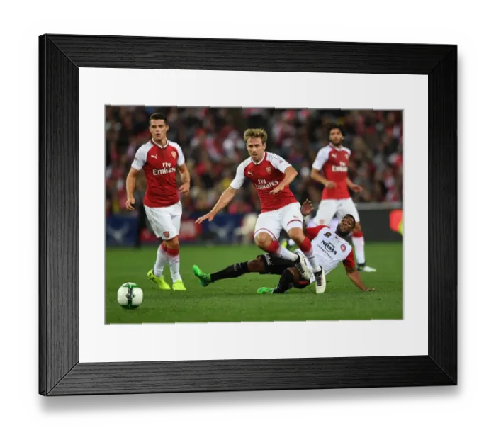 Framed Print : Nacho Monreal vs. Abraham Majok: A Clash of Football Titans (Sydney, Australia 2017)