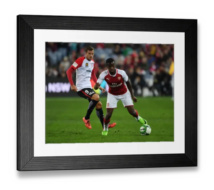 Framed Print : Eddie Nketiah Outmaneuvers Rory Bonevacia: Arsenal vs. Western Sydney Wanderers