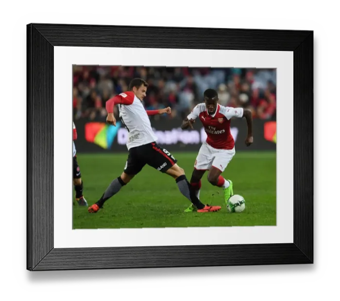 Framed Print : Arsenal's Eddie Nketiah Outmaneuvers Rory Bonevacia: A Shining Moment in Sydney Framed Print : Arsenal's Eddie Nketiah Outmaneuvers Rory Bonevacia: A Shining Moment in Sydney