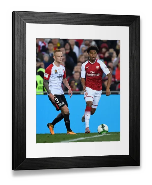 Framed Print : Reiss Nelson vs Jack Clisby: Battle on the Soccer Field between Western Sydney Wanderers and Arsenal FC Framed Print : Reiss Nelson vs Jack Clisby: Battle on the Soccer Field between Western Sydney Wanderers and Arsenal FC