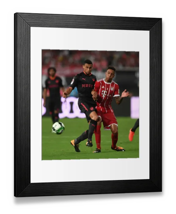 Framed Print : Coquelin vs. Tolisso: Battle in Shanghai - Bayern Munich vs. Arsenal Pre-Season Clash Framed Print : Coquelin vs. Tolisso: Battle in Shanghai - Bayern Munich vs. Arsenal Pre-Season Clash