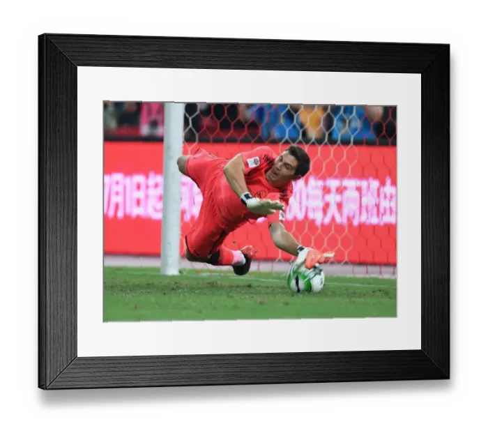 Framed Print : Emiliano Martinez Saves Penalty in Thrilling Bayern Munich vs. Arsenal Shootout