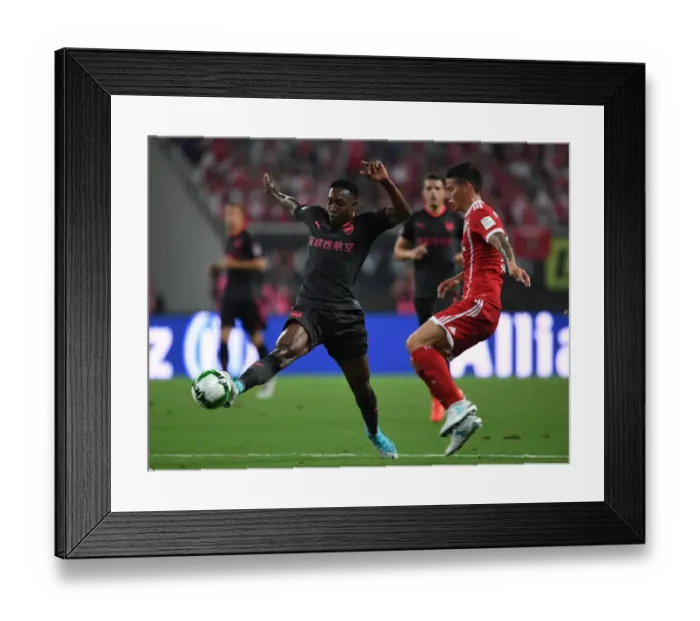 Framed Print : Danny Welbeck vs James Rodriguez: Battle in Shanghai - Bayern Munich vs Arsenal Pre-Season Clash