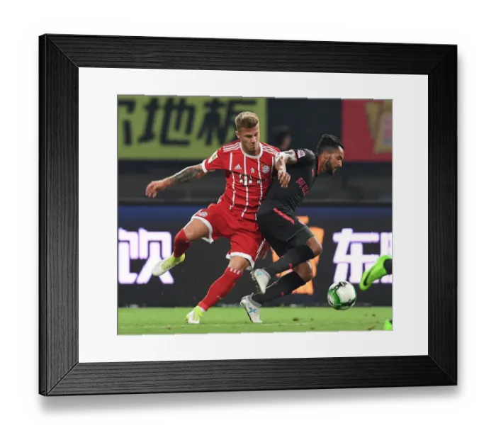 Framed Print : Clash in Shanghai: Walcott vs. Dorsch - Bayern Munich vs. Arsenal Pre-Season Friendly
