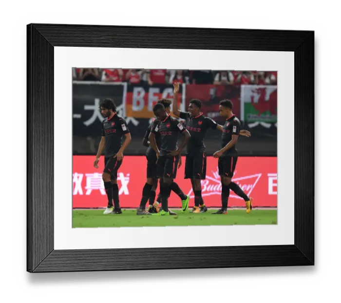 Framed Print : Arsenal's Iwobi, Nelson, and Bramall Celebrate Goal Against Bayern Munich in Shanghai Friendly, 2017