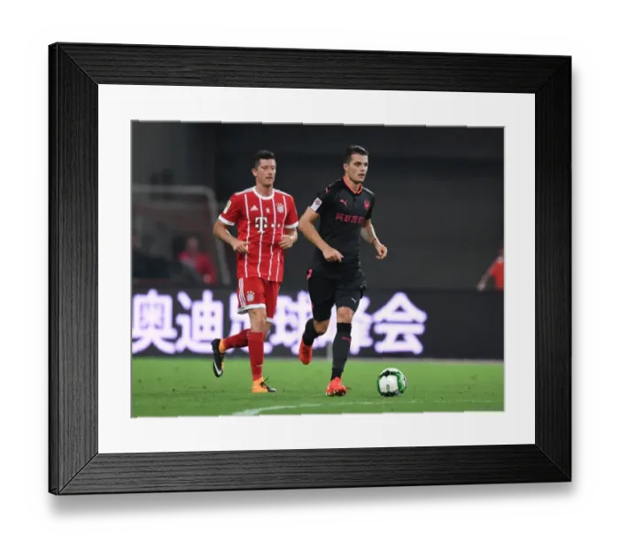Framed Print : Granit Xhaka: Arsenal's Midfield Maestro Shines Against Bayern Munich in Shanghai, 2017 Framed Print : Granit Xhaka: Arsenal's Midfield Maestro Shines Against Bayern Munich in Shanghai, 2017