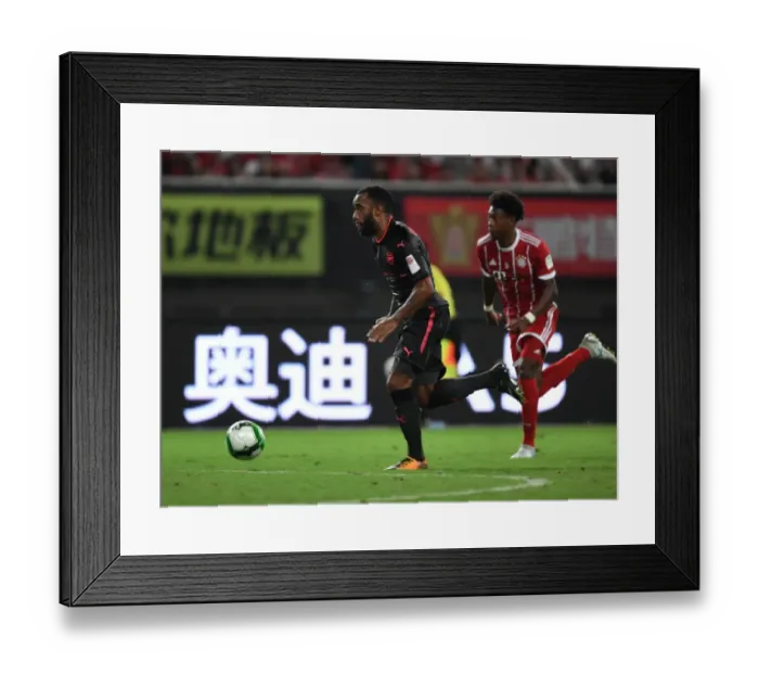 Framed Print : Alexandre Lacazette vs. David Alaba: Battle at the Shanghai Pre-Season Friendly between Bayern Munich and Arsenal Framed Print : Alexandre Lacazette vs. David Alaba: Battle at the Shanghai Pre-Season Friendly between Bayern Munich and Arsenal