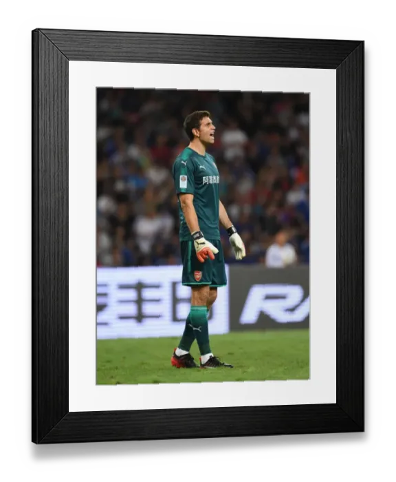 Framed Print : Emiliano Martinez: Arsenal's Tenacious Goalkeeper in Action Against Chelsea during Pre-Season Friendly in Beijing