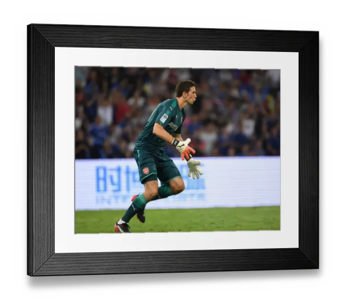 Framed Print : Emiliano Martinez: Arsenal's Defiant Goalkeeper in Action Against Chelsea in Beijing