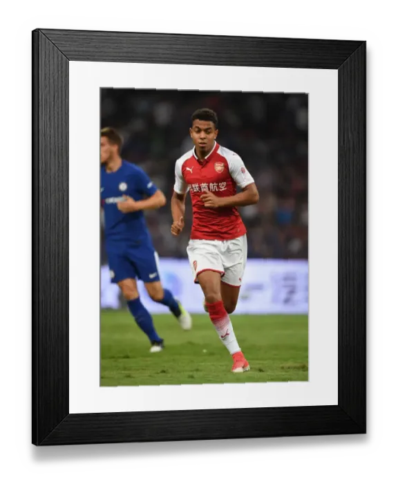 Framed Print : Arsenal's Donyell Malen Goes Head-to-Head Against Chelsea in Beijing Friendly