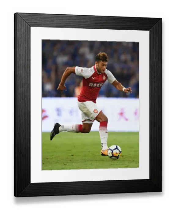 Framed Print : Arsenal's Alex Oxlade-Chamberlain Goes Head-to-Head with Chelsea in Beijing Pre-Season Clash