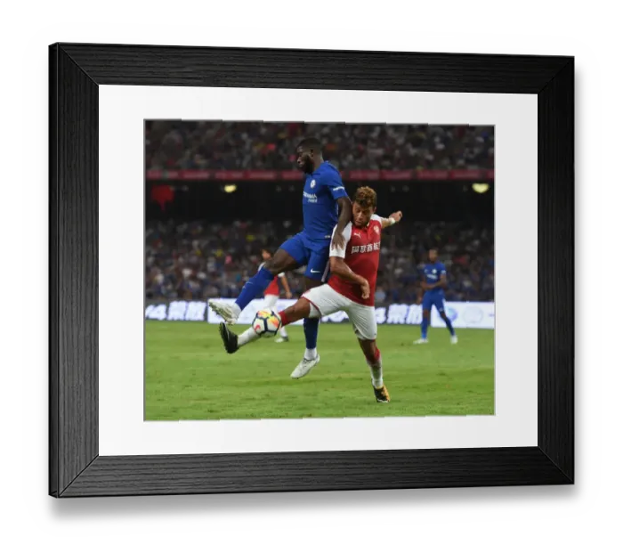 Framed Print : Clash of Talents: Oxlade-Chamberlain vs. Boga in Arsenal's Pre-Season Battle Against Chelsea