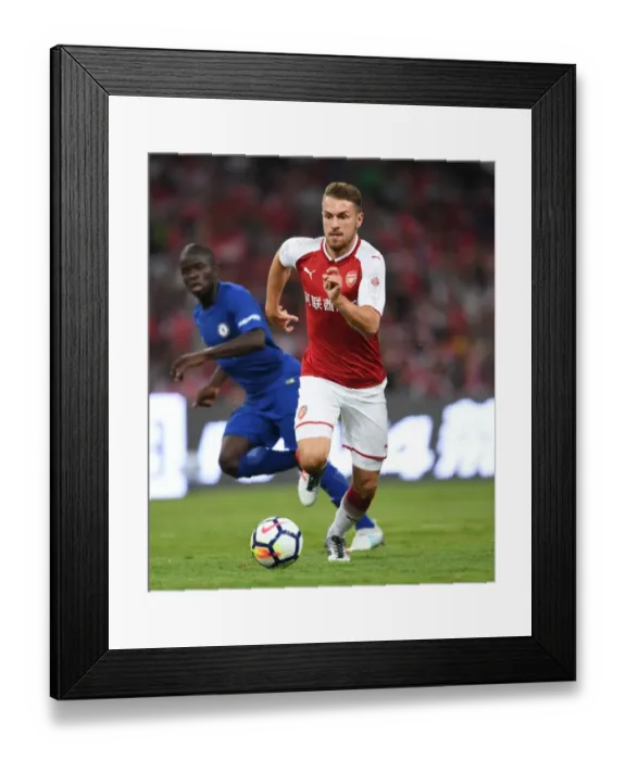 Framed Print : Arsenal's Aaron Ramsey Goes Head-to-Head Against Chelsea in Beijing Pre-Season Clash