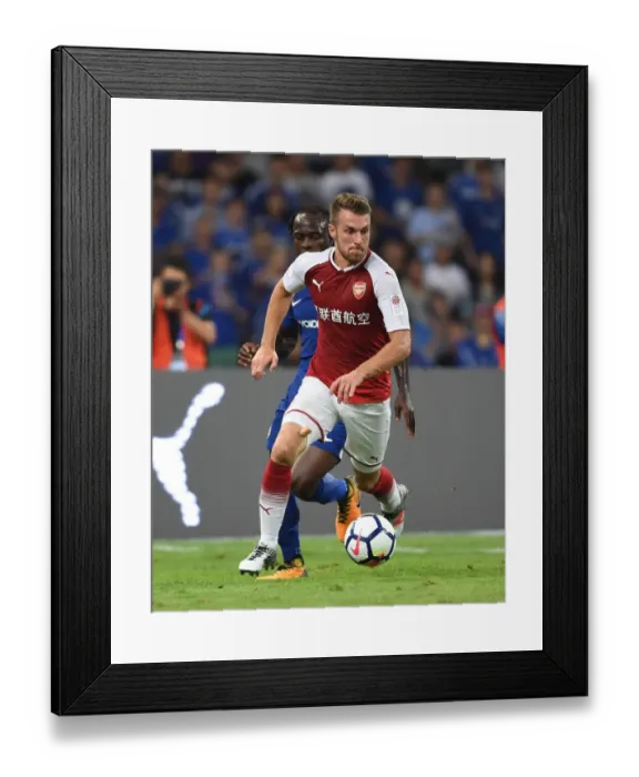 Framed Print : Arsenal's Aaron Ramsey Goes Head-to-Head Against Chelsea in Beijing Pre-Season Clash Framed Print : Arsenal's Aaron Ramsey Goes Head-to-Head Against Chelsea in Beijing Pre-Season Clash