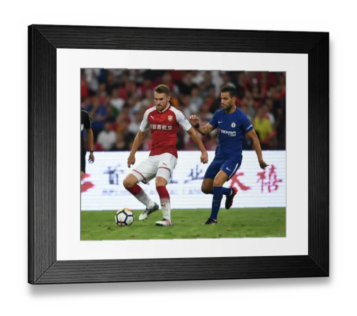 Framed Print : Ramsey vs. Fabregas: A Clash of Legends in Arsenal's Pre-Season Battle Against Chelsea