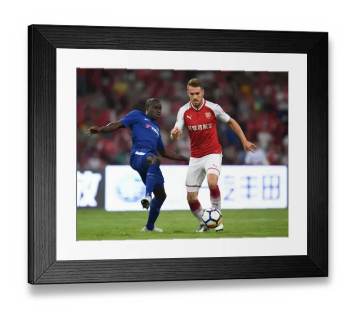 Framed Print : Arsenal's Aaron Ramsey Outsmarts Chelsea's N'Golo Kante: A Pre-Season Battle in Beijing