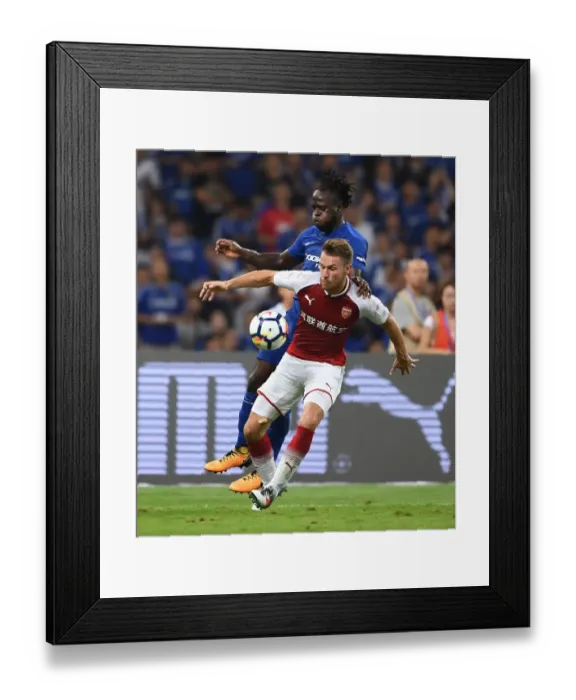 Framed Print : Arsenal's Aaron Ramsey vs. Chelsea's Victor Moses: A Battle in the Pre-Season Friendly in Beijing