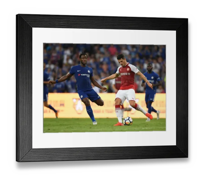 Framed Print : Clash of Titans: Xhaka vs Batshuayi in Arsenal's Pre-Season Battle with Chelsea