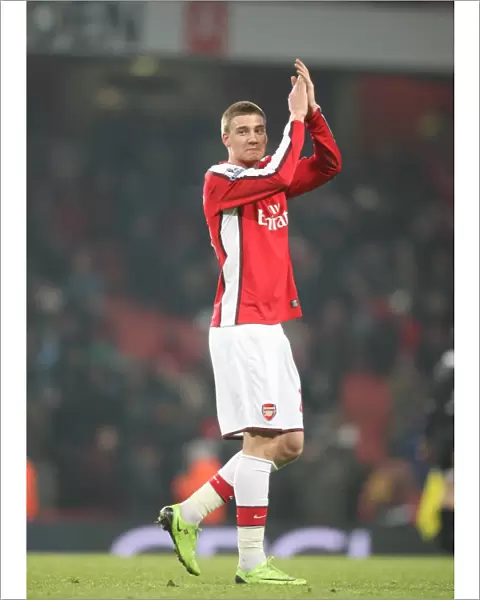 Nicklas Bendtner waves to the Arsenal fans after the match