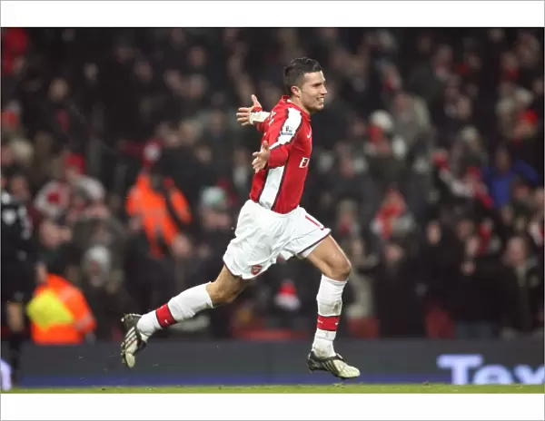Robin van Persie celebrates the Arsenal goal scored