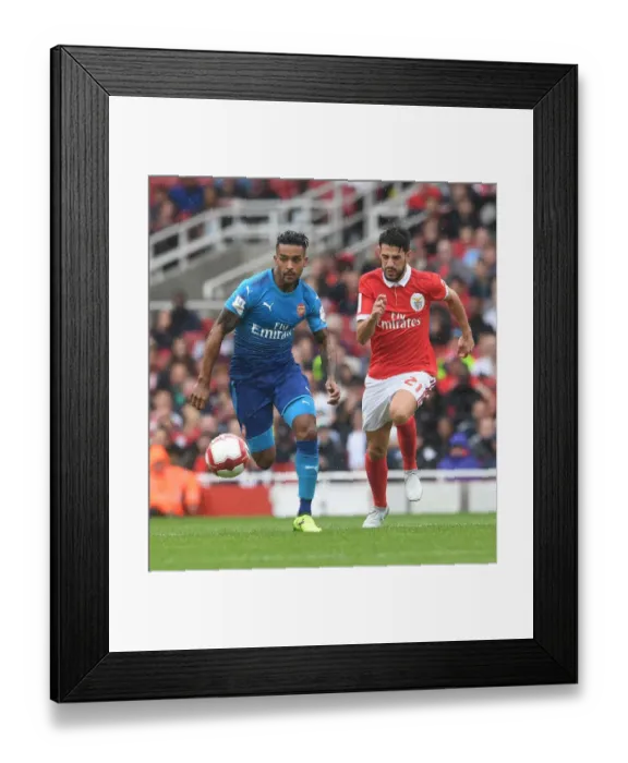 Framed Print : Theo Walcott's Agile Moves: Outmaneuvering Pizzi in Arsenal's Emirates Cup Victory Framed Print : Theo Walcott's Agile Moves: Outmaneuvering Pizzi in Arsenal's Emirates Cup Victory