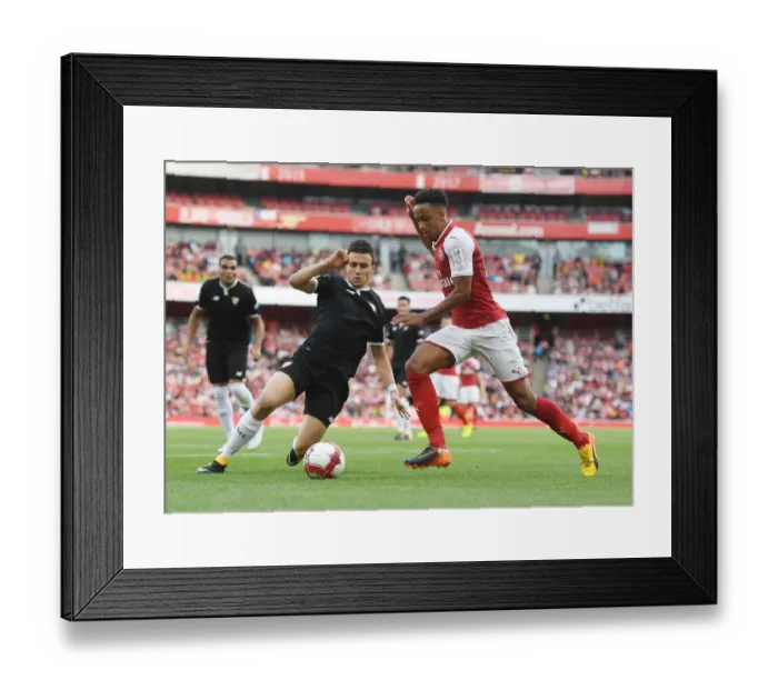 Framed Print : Arsenal's Cohen Bramall Clashes with Sevilla's Sebastien Corchia in Emirates Cup Match Framed Print : Arsenal's Cohen Bramall Clashes with Sevilla's Sebastien Corchia in Emirates Cup Match