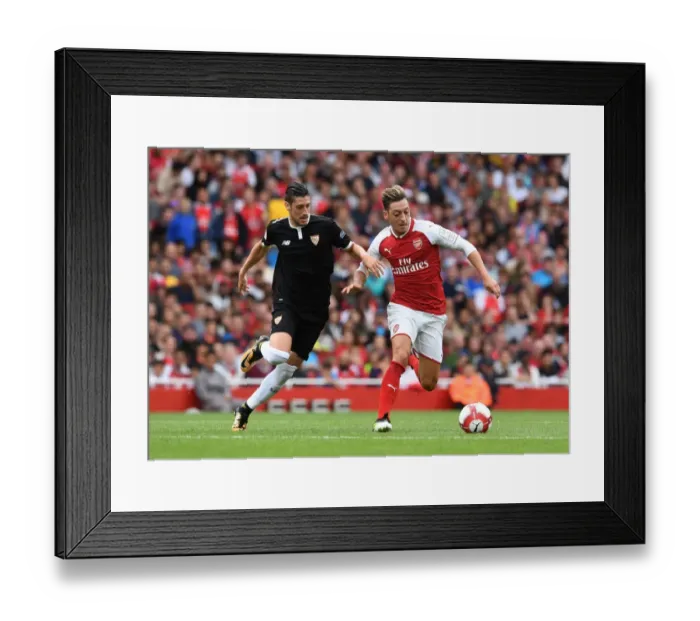 Framed Print : Mesut Ozil vs. Sergio Escudero: Clash at the Emirates Cup