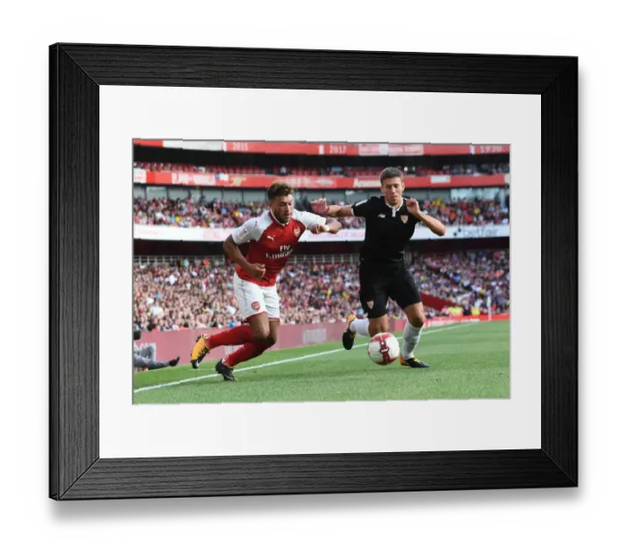 Framed Print : Arsenal's Alex Oxlade-Chamberlain Faces Off Against Sevilla's Sebastien Corchia at the Emirates Cup Framed Print : Arsenal's Alex Oxlade-Chamberlain Faces Off Against Sevilla's Sebastien Corchia at the Emirates Cup