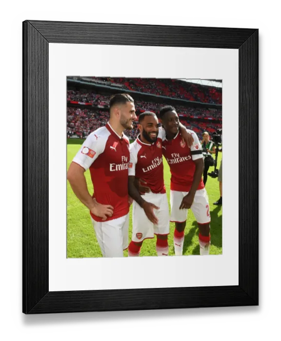 Framed Print : Arsenal Triumph in FA Community Shield: Kolasinac, Lacazette, and Welbeck's Jubilant Moment