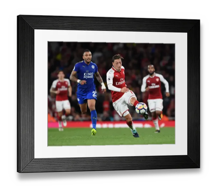 Framed Print : Mesut Ozil Outsmarts Danny Simpson: A Premier League Moment Framed Print : Mesut Ozil Outsmarts Danny Simpson: A Premier League Moment