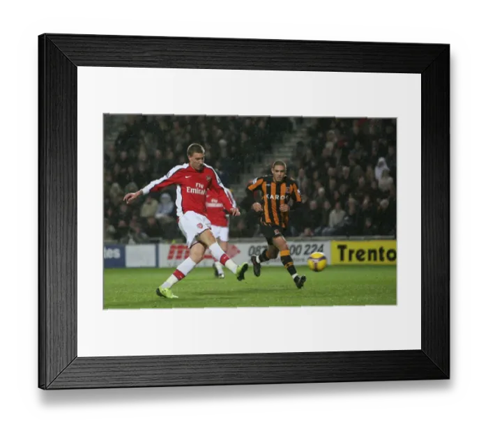 Framed Print : Nicklas Bendtner shoots past Hull goalkeeper Boaz Myhill Framed Print : Nicklas Bendtner shoots past Hull goalkeeper Boaz Myhill