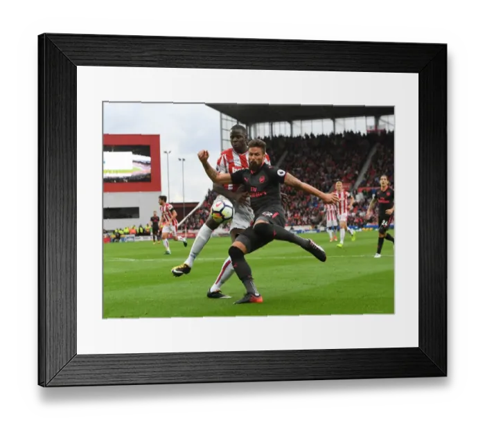 Framed Print : Giroud vs Zouma: Intense Battle at Stoke City vs Arsenal, Premier League 2017-18