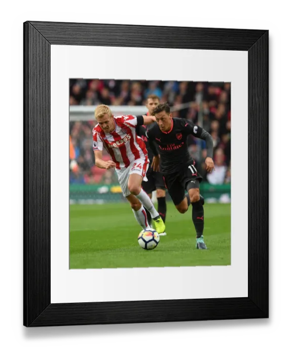 Framed Print : Mesut Ozil vs Darren Fletcher: A Premier League Battle at Bet365 Stadium Framed Print : Mesut Ozil vs Darren Fletcher: A Premier League Battle at Bet365 Stadium