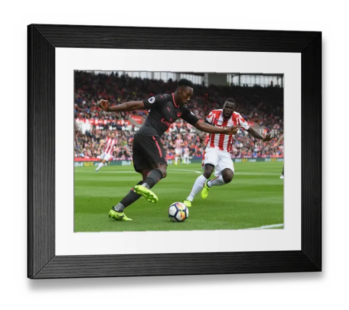 Framed Print : Danny Welbeck vs Mame Diouf: Battle at the Bet365 Stadium - Stoke City vs Arsenal, Premier League 2017-18