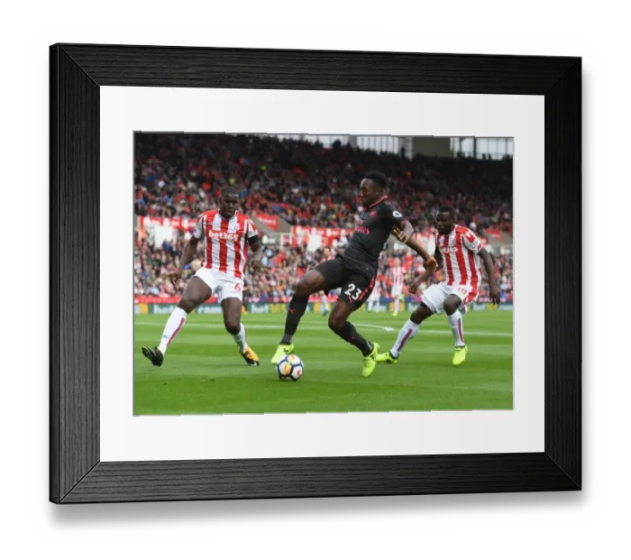 Framed Print : Clash at the Bet365: Welbeck Tangles with Diouf and Kouma of Stoke City in Premier League Showdown Framed Print : Clash at the Bet365: Welbeck Tangles with Diouf and Kouma of Stoke City in Premier League Showdown