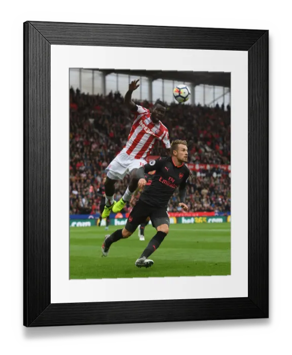 Framed Print : Clash at the Bet365: Ramsey vs. Diouf in Stoke City vs. Arsenal Framed Print : Clash at the Bet365: Ramsey vs. Diouf in Stoke City vs. Arsenal