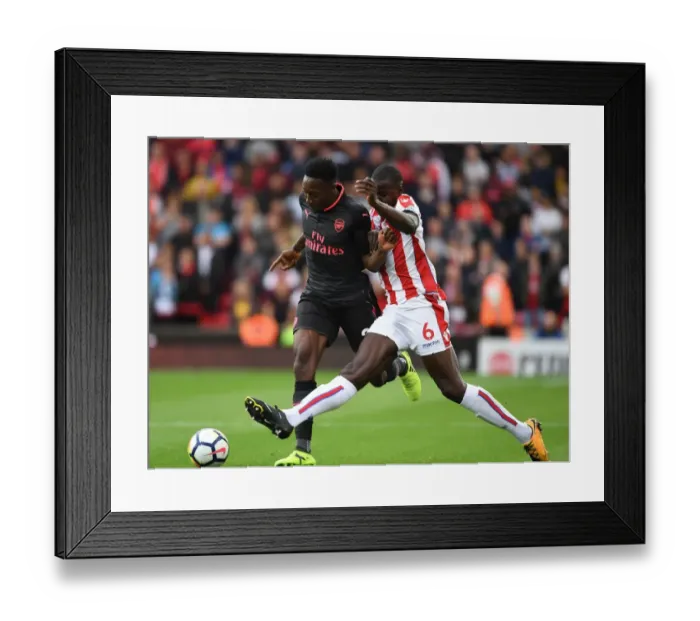 Framed Print : Intense Face-Off: Welbeck vs Zouma, Premier League 2017-18 - Arsenal's Welbeck Goes Head to Head with Stoke's Zouma