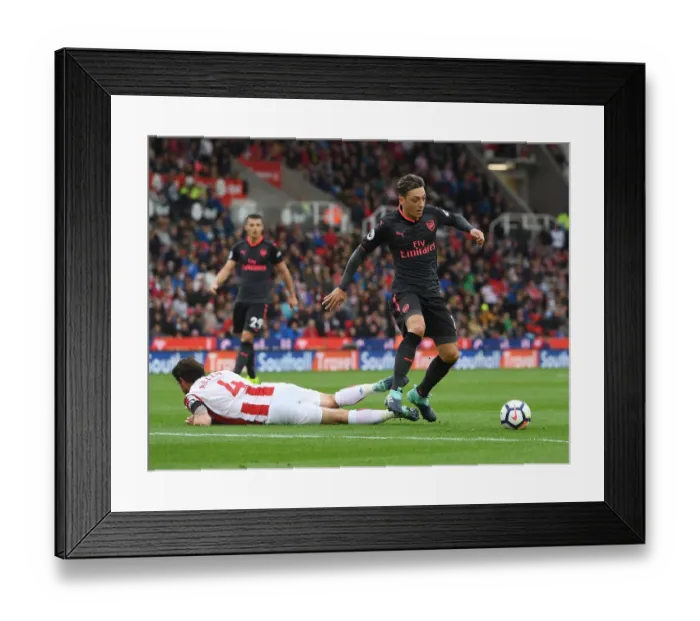 Framed Print : Mesut Ozil vs Joe Allen: Clash of Midfield Titans - Stoke City vs Arsenal, Premier League 2017-18