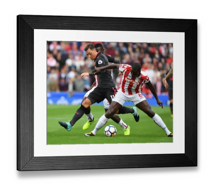 Framed Print : Mesut Ozil vs Kurt Zouma: A Premier League Face-Off Framed Print : Mesut Ozil vs Kurt Zouma: A Premier League Face-Off