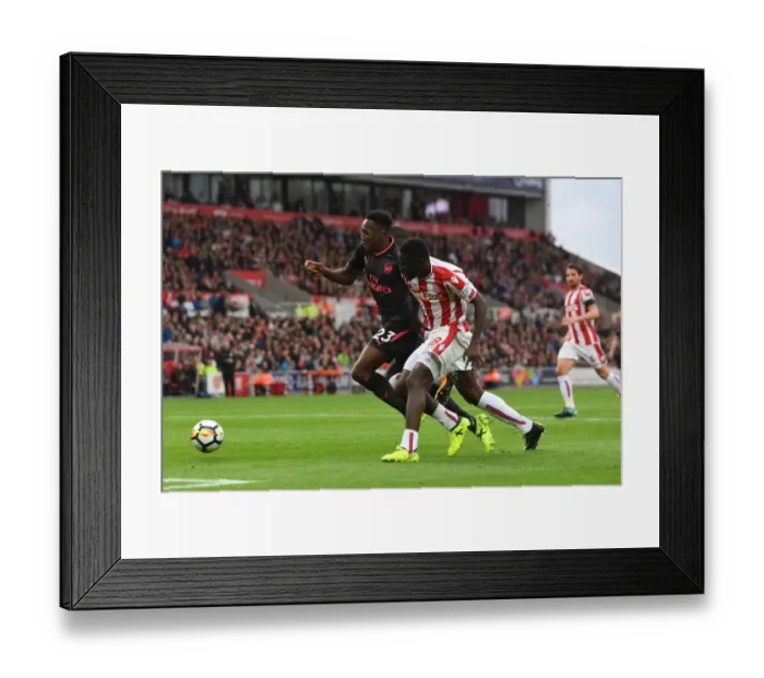 Framed Print : Danny Welbeck (Arsenal) Mame Diouf (Stoke). Stoke City 1: 0 Arsenal. Premier League Framed Print : Danny Welbeck (Arsenal) Mame Diouf (Stoke). Stoke City 1: 0 Arsenal. Premier League