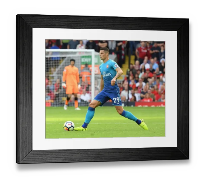 Framed Print : Granit Xhaka: Arsenal Midfielder Faces Off Against Liverpool in Premier League Clash Framed Print : Granit Xhaka: Arsenal Midfielder Faces Off Against Liverpool in Premier League Clash