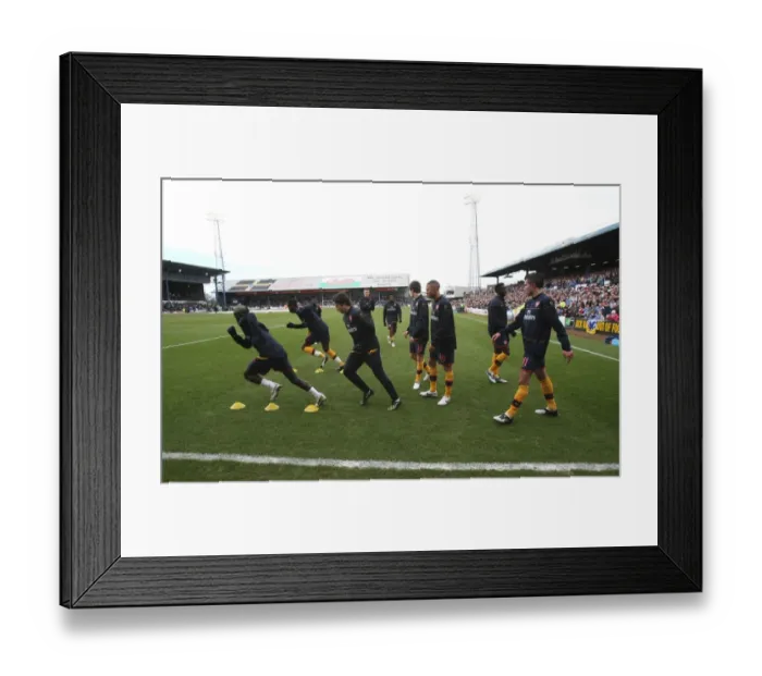 Framed Print : The Arsenal team warm up before the match Framed Print : The Arsenal team warm up before the match