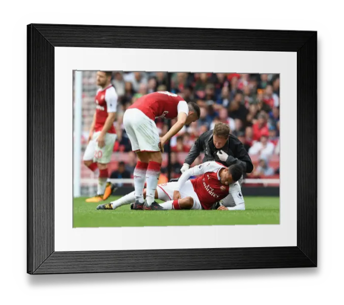Framed Print : Arsenal's Francis Coquelin Receives Treatment from Physio Colin Lewin vs AFC Bournemouth